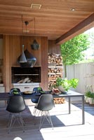 Modern decked patio with fireplace
