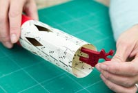 Step by Step guide for making Christmas Crackers from scratch - inserting gift