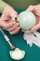 Create a simple Christmas bauble using newspaper -  removing bauble cap