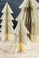 Using old books to create unique Christmas tree decorations - finished trees
