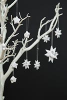 Using paper strips to create star shaped decorations - finished stars