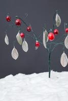 Using cotton wool and garden wire to create a Christmas tree - finished wire tree with Cotoneaster leaves and fresh Cranberries