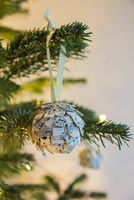 Step by Step guide for making paper cones using music sheet paper - finished bauble on tree
