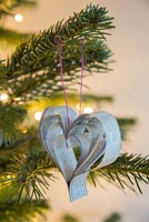 Creating a heart shaped decoration using newspaper and coloured thread - finished hearts
