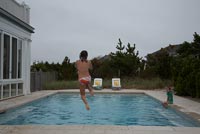 Child jumping in to pool