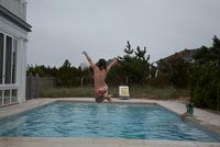 Child jumping in to pool