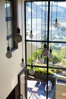 Contemporary pendant lights in entrance hall