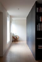 Contemporary hallway with built in storage