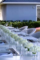 White dining table decorated with Hydrangea flowers