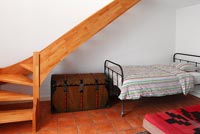 Compact bedroom under stairs