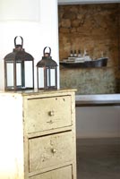 Lanterns on vintage chest of drawers
