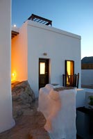 Greek villa lit up at night