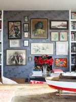 Eclectic art display on living room wall