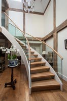 Modern staircase in country hallway