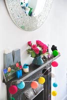 Colourful accessories on mantlepiece
