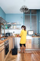 Woman working in her kitchen