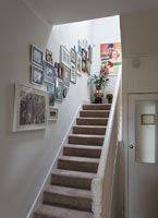 Framed art display on stairwell
