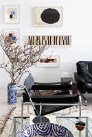 Leather armchair and abstract paintings by Robert Kelly