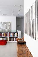 Open plan apartment with abstract paintings by Robert Kelly