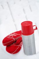 Thermos flask and mittens