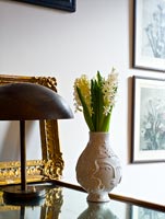 Hyacinths in white vase