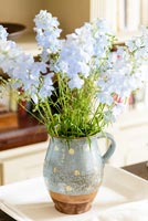 Blue flowers in polka dot jug