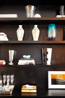 Vases displayed on black shelves