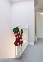 Christmas stockings hanging from bannisters