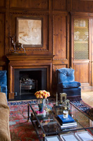 Ornate wooden panelling around fireplace