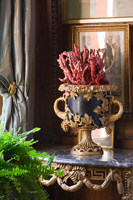 Ornate urn on marble console table