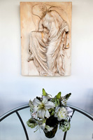 Classic sculpture mounted on wall