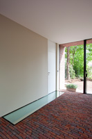 Brick and glass flooring in hall
