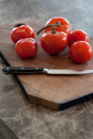 Tomatoes on chopping board