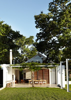 Contemporary house with patio under pergola