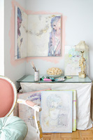Display of portrait paintings around dressing table
