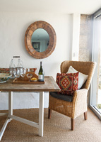 Wicker armchair at dining table