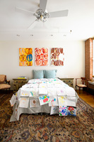 Bedroom with colourful art display