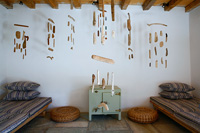 Wooden mobiles hanging from beams