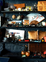 Collectibles displayed on black shelving