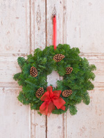 Christmas wreath with conifer foliage and pine cones