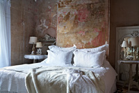 Vintage bedroom with distressed plaster walls