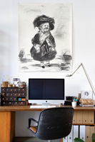 Portrait above wooden desk