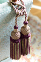 Decorative tassels hanging from sofa