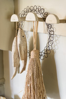Accessories hanging from wooden hooks