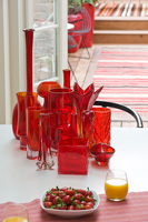 Collection of red glassware on dining table
