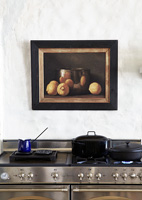 Still life painting above modern range cooker