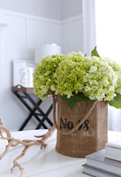 Green flowers in hessian container