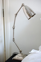 Anglepoise lamp by bed
