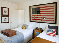 Guest bedroom with framed US flag
