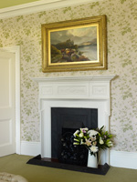 Landscape painting above fireplace